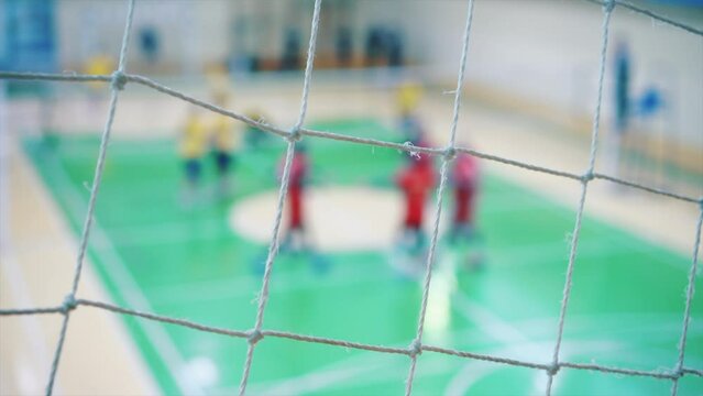 Sport mesh on blurred background of volleyball game, indoor. Competition concept, selective focus.
