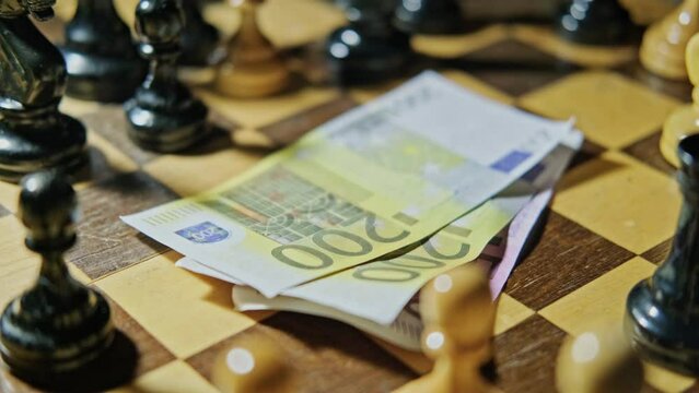 Euro money on a vintage chessboard with retro chess pieces