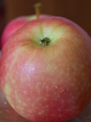 A ripe apple of the Ligol variety, a close-up shot.