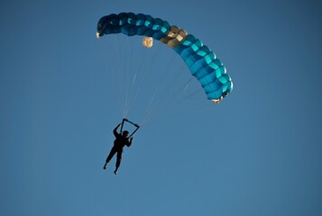 Parachute Flying Against Blue Sky in Locarno, Switzerland.