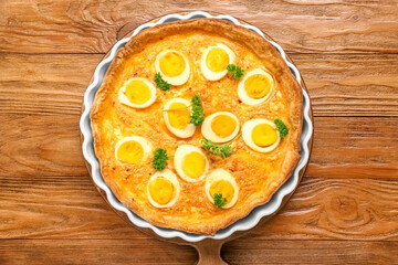 Delicious Easter tart with eggs on wooden background
