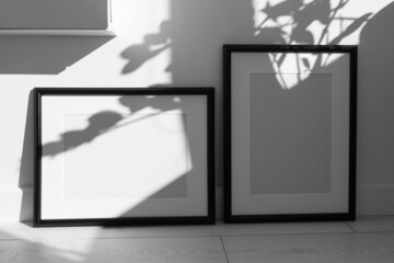 Two minimalist black frame mockup on white background with shadow in interior