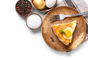 Plate with piece of tasty Easter tart and spices on white background