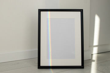 Minimalist black frame mockup on white background with shadow in interior