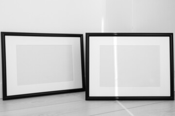 Fototapeta na wymiar Two minimalist black frame mockup on white background with shadow in interior