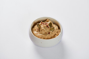 Ají de pepa is a traditional ecuadorian hot sauce made of squash seeds. It’s on a white background 