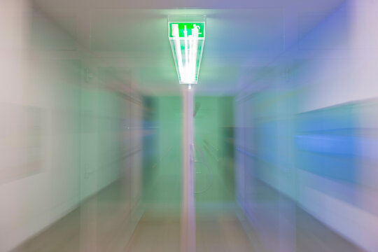 Illuminated Tunnel at Night with Exit Sign and with Light Effect in Switzerland.