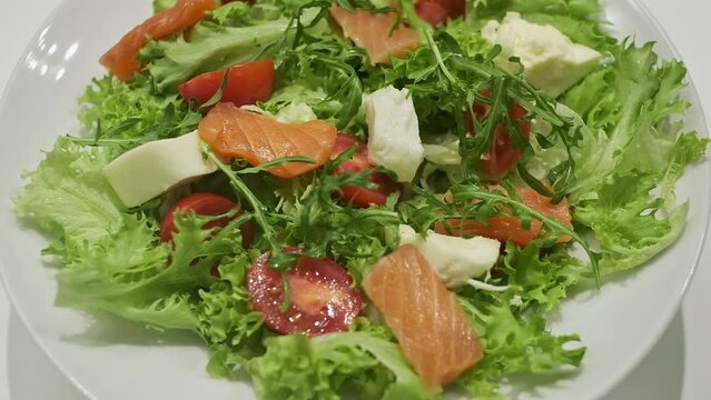 Appetizing Salad On Plate. Tasty Food. Chefs Hands In Gloves. He Puts Arugula In Salad.