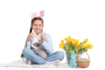 Little girl with Sphynx cat, Easter eggs, rabbit and tulips on white background