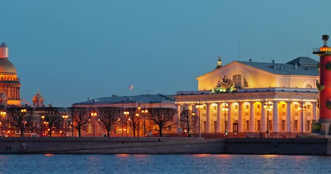 Russia, Saint-Petersburg in dusk, landmarks of city in night illumination, Rostral Columns, Palace Bridge, reflections on water, Admiralty building, Isaac cathedral
