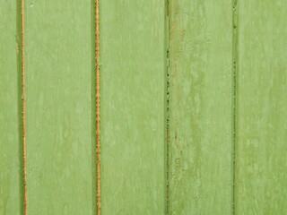 Background of green boards. The wooden fence is painted green. - 490390538