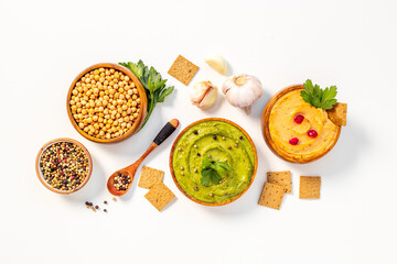 Hummus with snacks set - various types of hummus in bowls