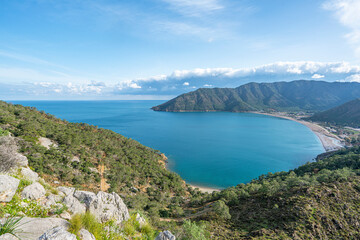 The Scenic view of  Bay of Adrasan from the Adrasan Castle, naturally protected area, surrounded by a national park with pine forests, Taurus Mountains, blue water lagoons and sandy beaches.