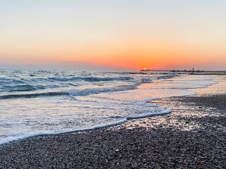 The sea in the light of the setting sun. Sunset