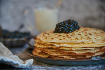 Pancake week. Delicious Pancakes with black caviar.