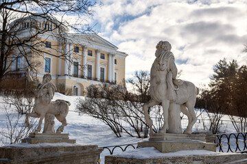 Bridge of the Centaurs across the Slavyanka River in Pavlovsk Park against the backdrop of the Imperial Palace