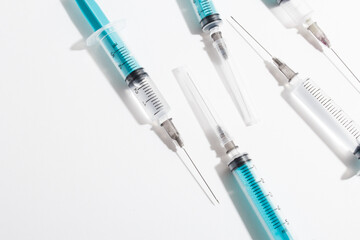 Fototapeta premium Medical syringe on a white background. A syringe for injection. The concept of health and beauty