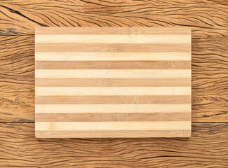 Empty wooden board with copy space over wooden table
