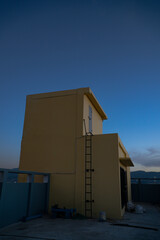 on the roof of a building in the morning with a blue sky in the city of Bandung, Indonesia