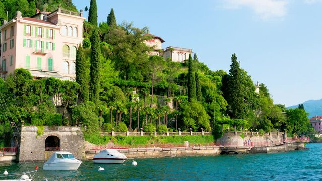 Varenna, the Lombard village of lovers on Lake Como. The small village of Varenna is the perfect place for a romantic weekend. The Walk of Lovers is pedestrian path over water of lake. RAW CINEMATIC