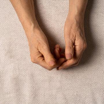 The hands of an elderly woman. High quality photo