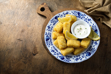 Traditional homemade fish croquettes with sauce