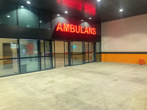Kartal, Istanbul, Turkey - 07.24.2021: red ambulance sign on entrance gate exterior of Lutfi Kirdar Training and Research Hospital emergency department for healthcare curing illness concepts