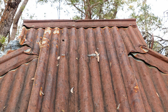 Photograph of an old and damaged rusty roof on a shelter in The Blue Mountains in Australia