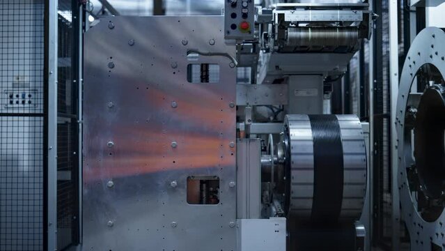 Tyre stamping robotic machine manufacturing rubber product at modern factory
