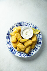 Traditional homemade fish croquettes with sauce