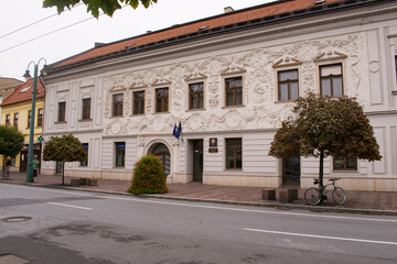 Beautiful white building with decorative cornices.