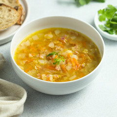 Traditional pea soup with smoked bacon	