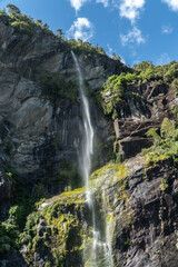 Fairy Falls in Milford Sound Fiordland National Park in the South Island of New Zealand on a Bright Summers Day