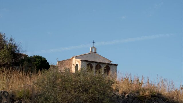 Church in the mountain at sunset. Time lapse.