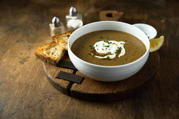 Homemade creamy lentil soup with herbs