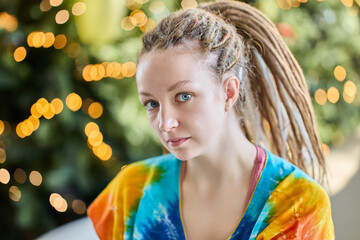 Portrait of european woman 28 years old with dreadlock african braids indoors.