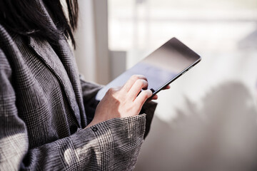 unrecognizable business woman using digital tablet in office, co working, technology