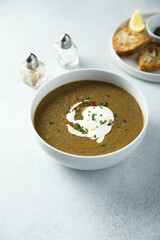 Homemade creamy lentil soup with herbs