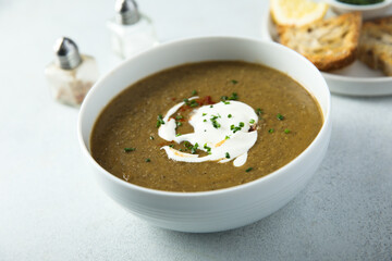 Homemade creamy lentil soup with herbs