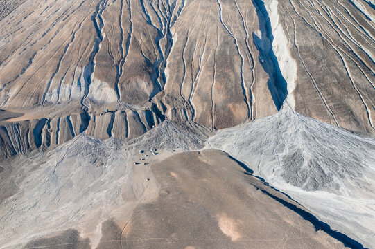 Cracks on surface of mine tailings caused by wind and water. Abandoned asbestos mine in Amiantos, Cyprus