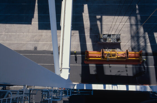 Looking from top of crane down at securred shipping container ready for raising up and loading