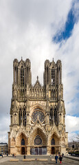 REIMS, FRANCE - FEBRUARY 11th, 2022: Facade of Reims cathedral, traditional location for the...