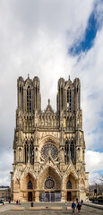 REIMS, FRANCE - FEBRUARY 11th, 2022: Facade of Reims cathedral, traditional location for the coronation of the kings of France,