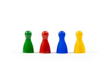 Row of 4 different diverse multi colored game pieces representing a diverse group of people, corporate business company teamwork, diversity and togetherness simple metaphor, abstract concept, nobody