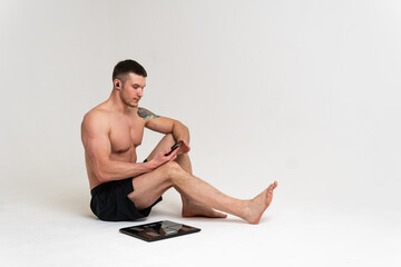 Fototapeta premium Man with weights health pondered, health and sports on a white background pain body injury, ill male adult, illness Tension neck care, ain suffer attractive