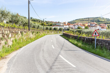 N2 paved road entering Quintião (Cambres) village, municipality of Lamego, district of Viseu, Portugal - obrazy, fototapety, plakaty
