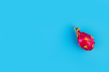 Dragon fruit or pitaya isolated on blue background as package design element. Pitahaya wallpaper. banner concept. Minimal fruit concept. banner advertising concept