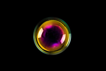 Soap bubble isolated on black background. Copy space.