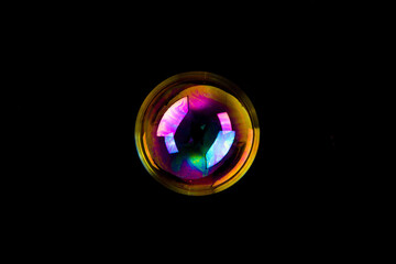 Soap bubble isolated on black background. Copy space.