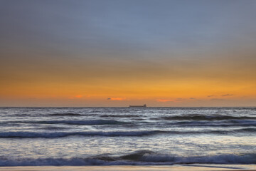 Fototapeta na wymiar Orange glow sunrise seascape